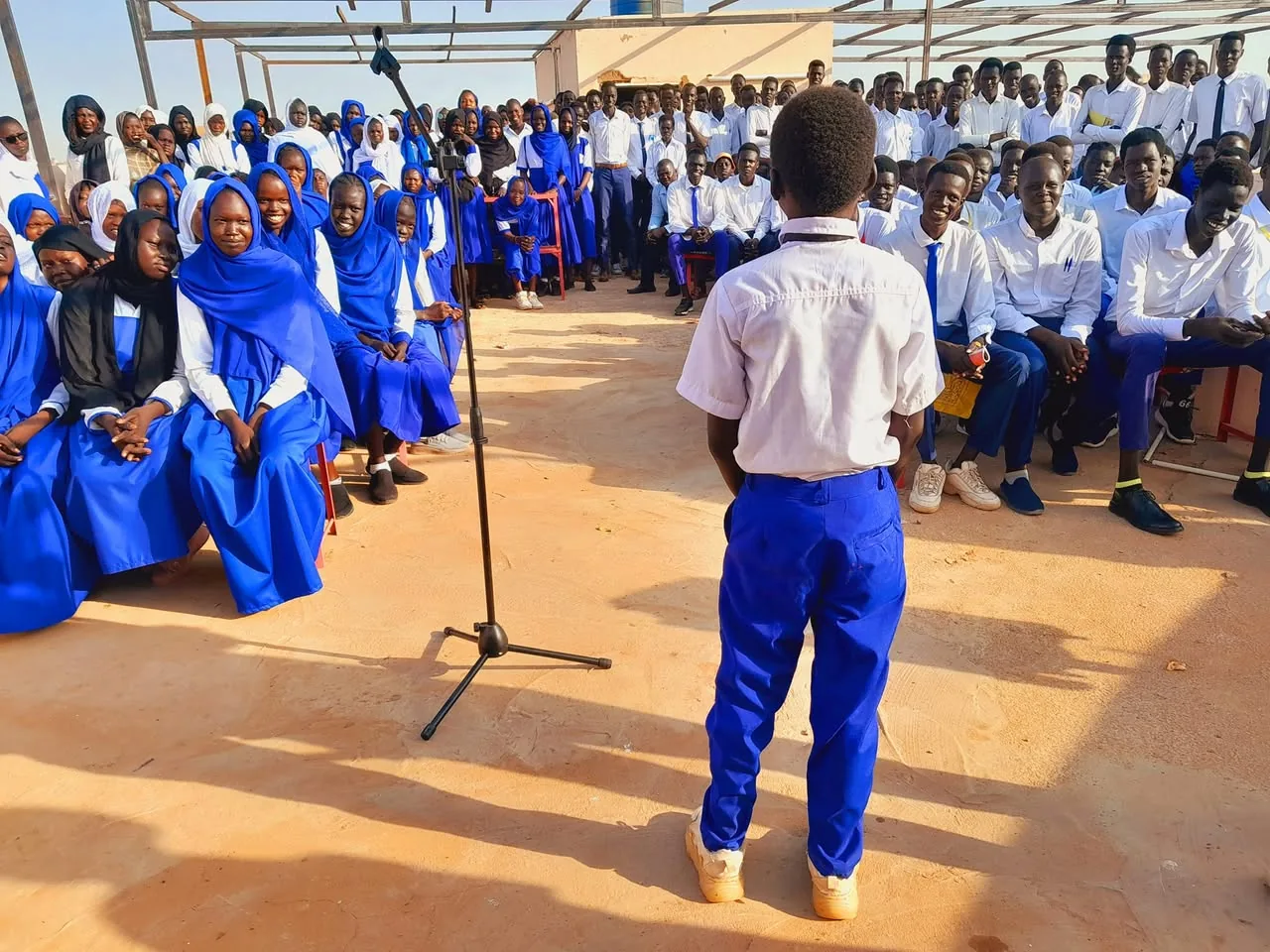 Bijany leading the morning prayer in front of his classmates